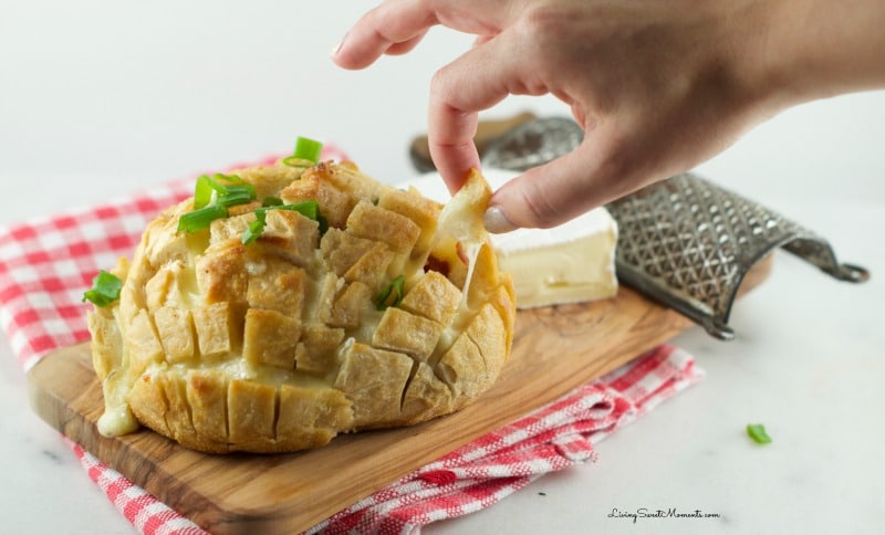 This delicious cheesy bacon Pull Apart Bread Recipe is so easy to make with oozy brie and smoked bacon. The perfect appetizer for the Superbowl. My favorite!