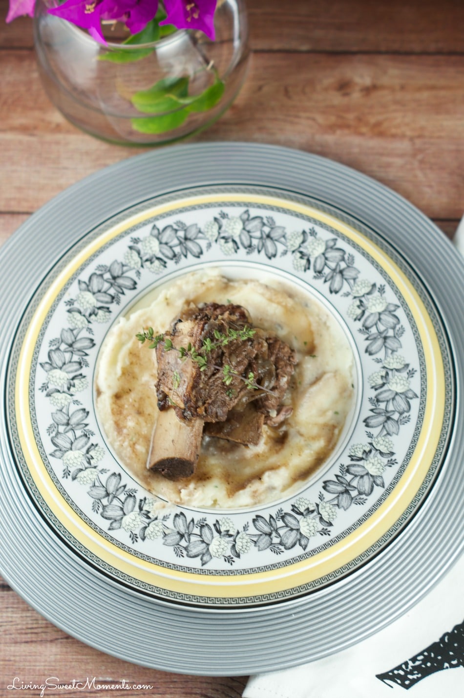 Slow Cooker Short Ribs - Made with red wine and delightful herbs. This delicious dish falls off the bone creating tender flavorful beef that requires very little prep.