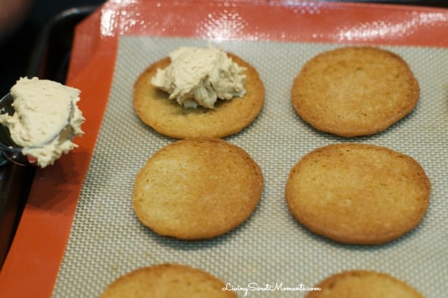 Copycat Nutter Butter Cookies - these homemade peanut butter cookies filled with delicious creamy peanut frosting are more delicious than the original kind. 