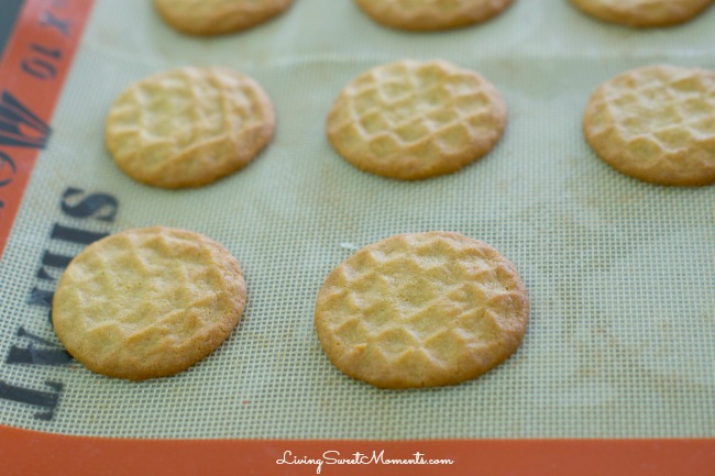 Copycat Nutter Butter Cookies - these homemade peanut butter cookies filled with delicious creamy peanut frosting are more delicious than the original kind. 