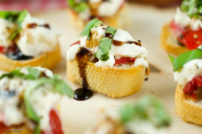 Roasted Red Pepper Burrata Crostini - crispy baguette slices are topped with roasted red peppers, creamy burrata, basil and a splash of balsamic glaze.