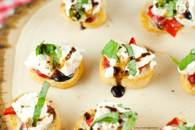 Roasted Red Pepper Burrata Crostini - crispy baguette slices are topped with roasted red peppers, creamy burrata, basil and a splash of balsamic glaze.