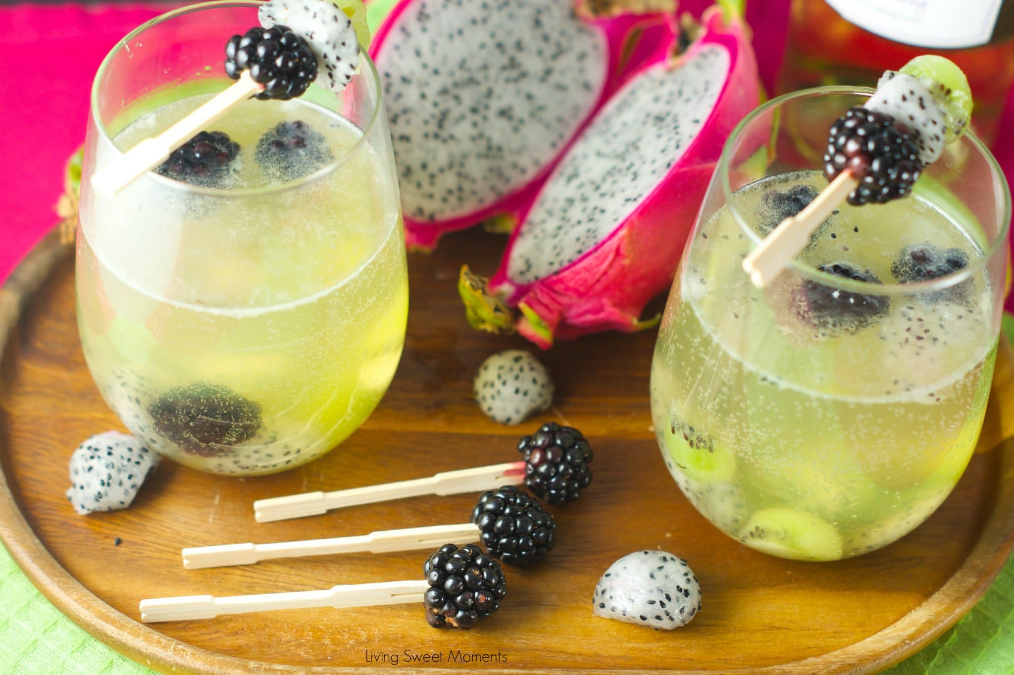 Tropical Moscato Sangria: delicious bubbly moscato with chunks of kiwi, dragon fruit and blackberries. The perfect summer cocktail drink for summer parties.