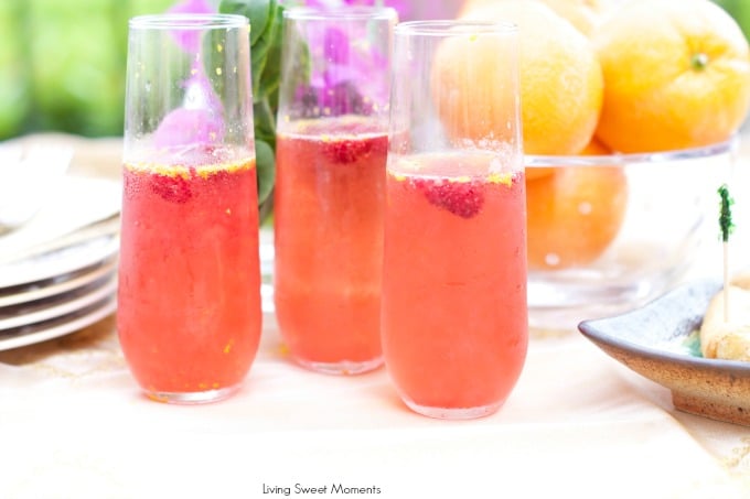 Orange raspberry sparkling wine cocktail: the ultimate summer cocktail! Combine cointreau with raspberry sorbet, fresh raspberries in a bubbly delicious drink. 