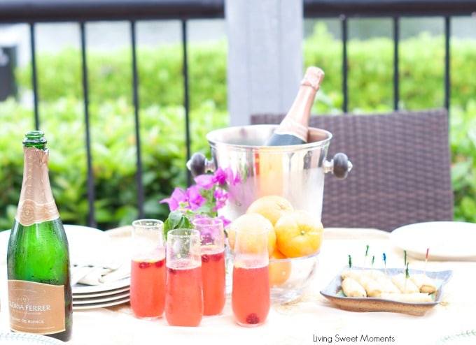 Orange raspberry sparkling wine cocktail: the ultimate summer cocktail! Combine cointreau with raspberry sorbet, fresh raspberries in a bubbly delicious drink. 