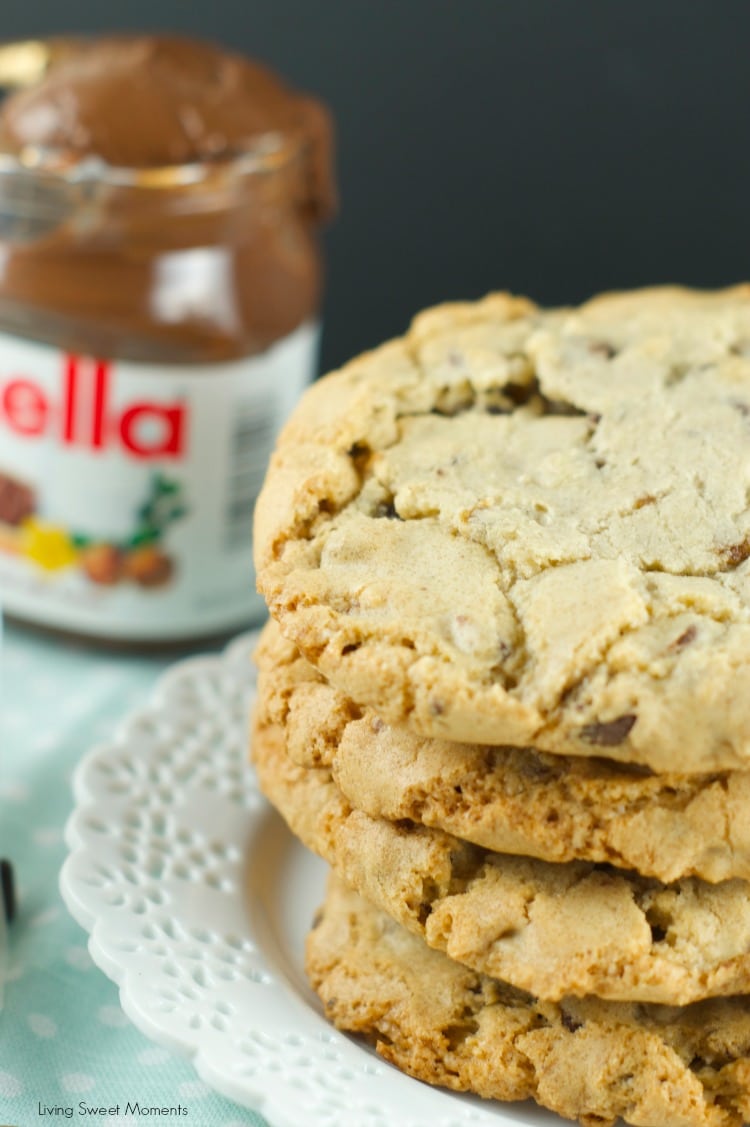 Nutella Stuffed Chocolate Chip Cookies - chewy chocolate chips cookies are filled with creamy Nutella. The perfect indulgent dessert for kids and adults. More on www.livingsweetmoments.com