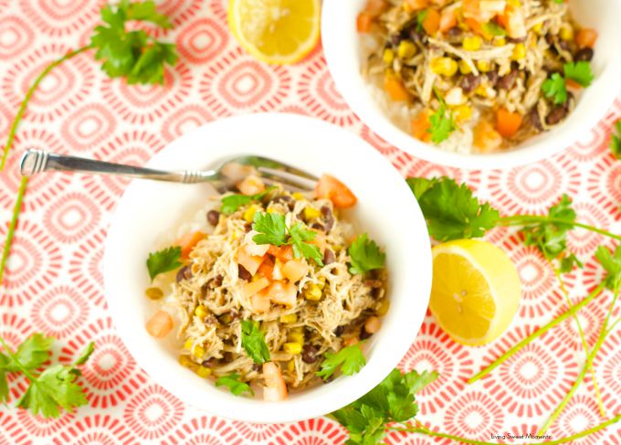 Slow Cooker Chicken And Black Beans - Delicious chicken is slow cooked in beans, corn, salsa verde and spices. Enjoy over rice or as a burrito bowl. Perfect weeknight dinner idea! 