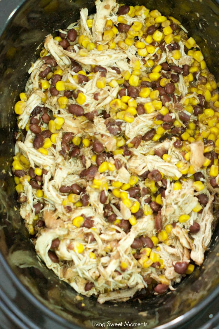 Slow Cooker Chicken And Black Beans - Delicious chicken is slow cooked in beans, corn, salsa verde and spices. Enjoy over rice or as a burrito bowl. Perfect weeknight dinner idea! 