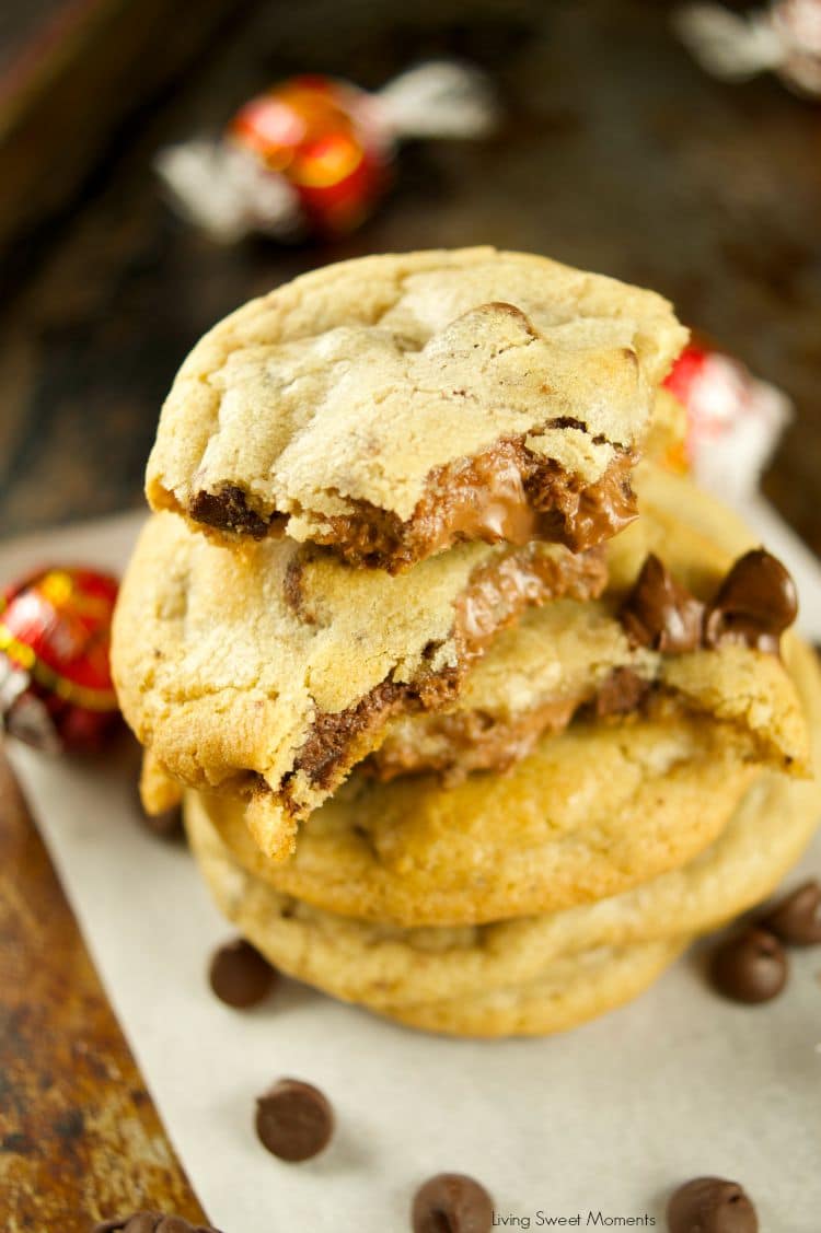 Truffle Stuffed Chocolate Chip Cookies - these chewy chocolate chip cookies are ooey gooey and stuffed with a chocolate truffle. The best cookie recipe! Yum