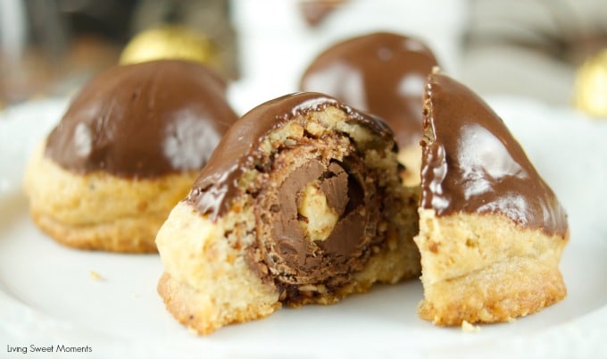 This Ferrero stuffed hazelnut cookies are topped with melted chocolate. The perfect crispy cookie recipe that will wow a crowd. Best dessert ever! Yum