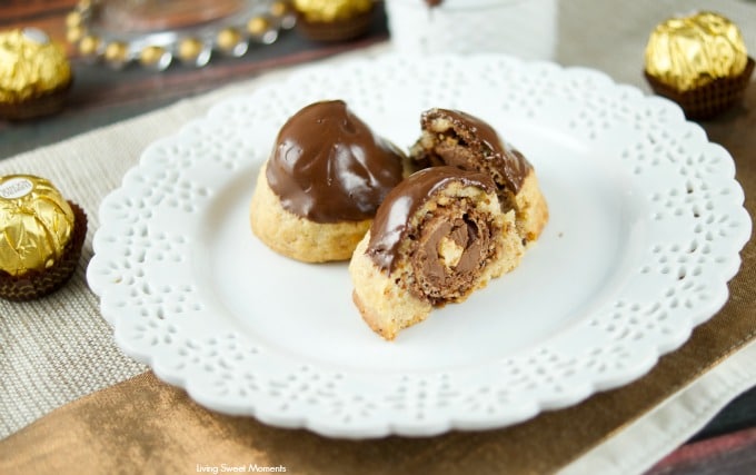 This Ferrero stuffed hazelnut cookies are topped with melted chocolate. The perfect crispy cookie recipe that will wow a crowd. Best dessert ever! Yum