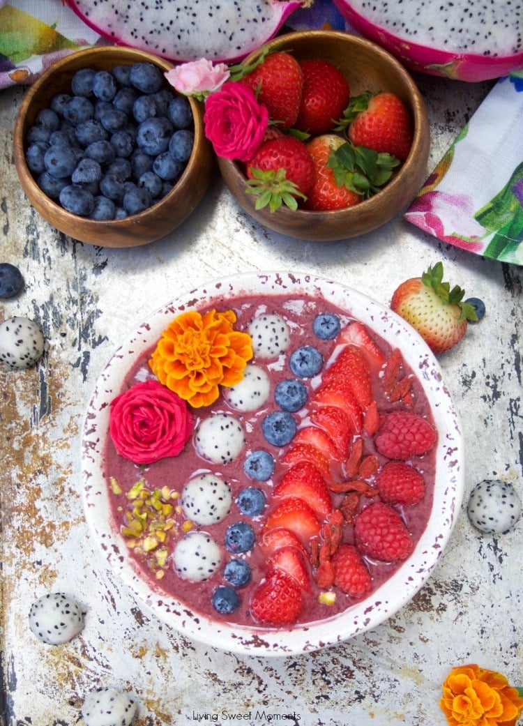 This delicious acai bowl recipe is blended with berries, dragonfruit, and yogurt. It's topped with fresh fruit and nuts. A healthy and quick breakfast idea.