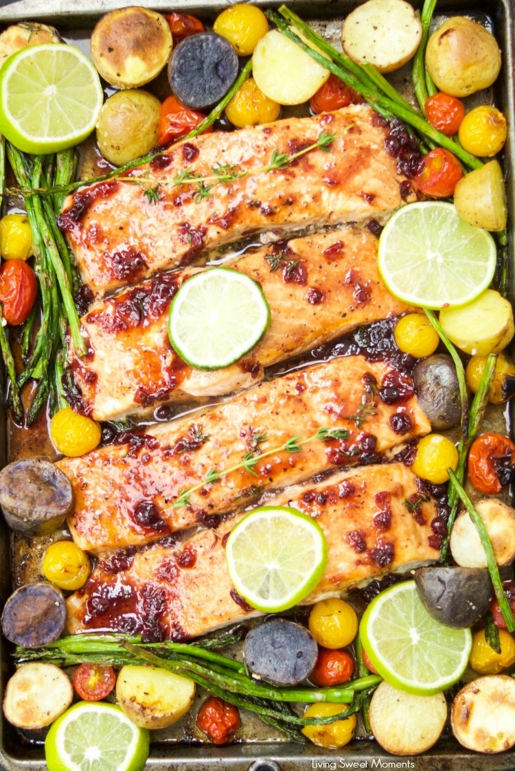 This delicious & easy Salmon Sheet Pan Dinner recipe is made in 30 minutes or less and has a sweet tangy sauce. Served with potatoes, asparagus, & tomatoes.