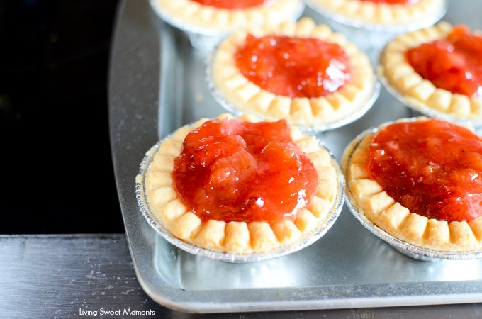 These delicious and tangy Strawberry Rhubarb Tarts are super easy to make and are the perfect mini desserts for any party. Top them with powdered sugar.