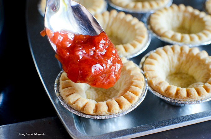 These delicious and tangy Strawberry Rhubarb Tarts are super easy to make and are the perfect mini desserts for any party. Top them with powdered sugar.