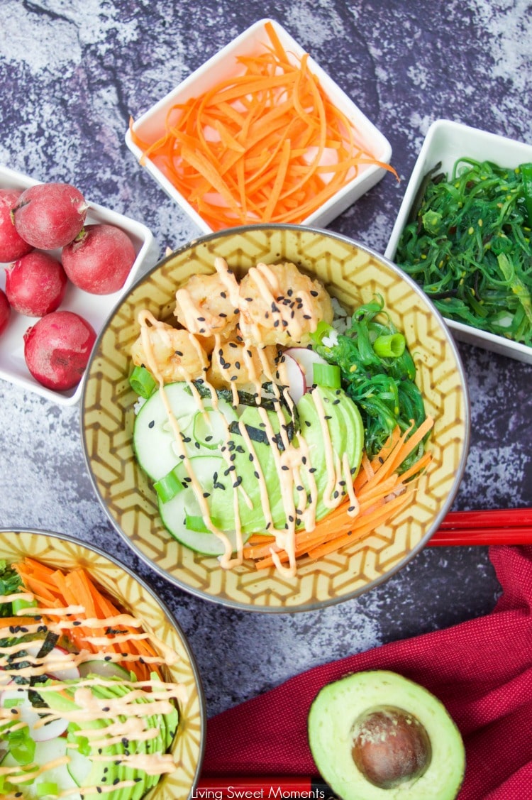 This delicious spicy shrimp poke bowl recipe is served with hot sushi rice, spicy mayo, avocados, radishes, and carrots. A quick weeknight dinner idea