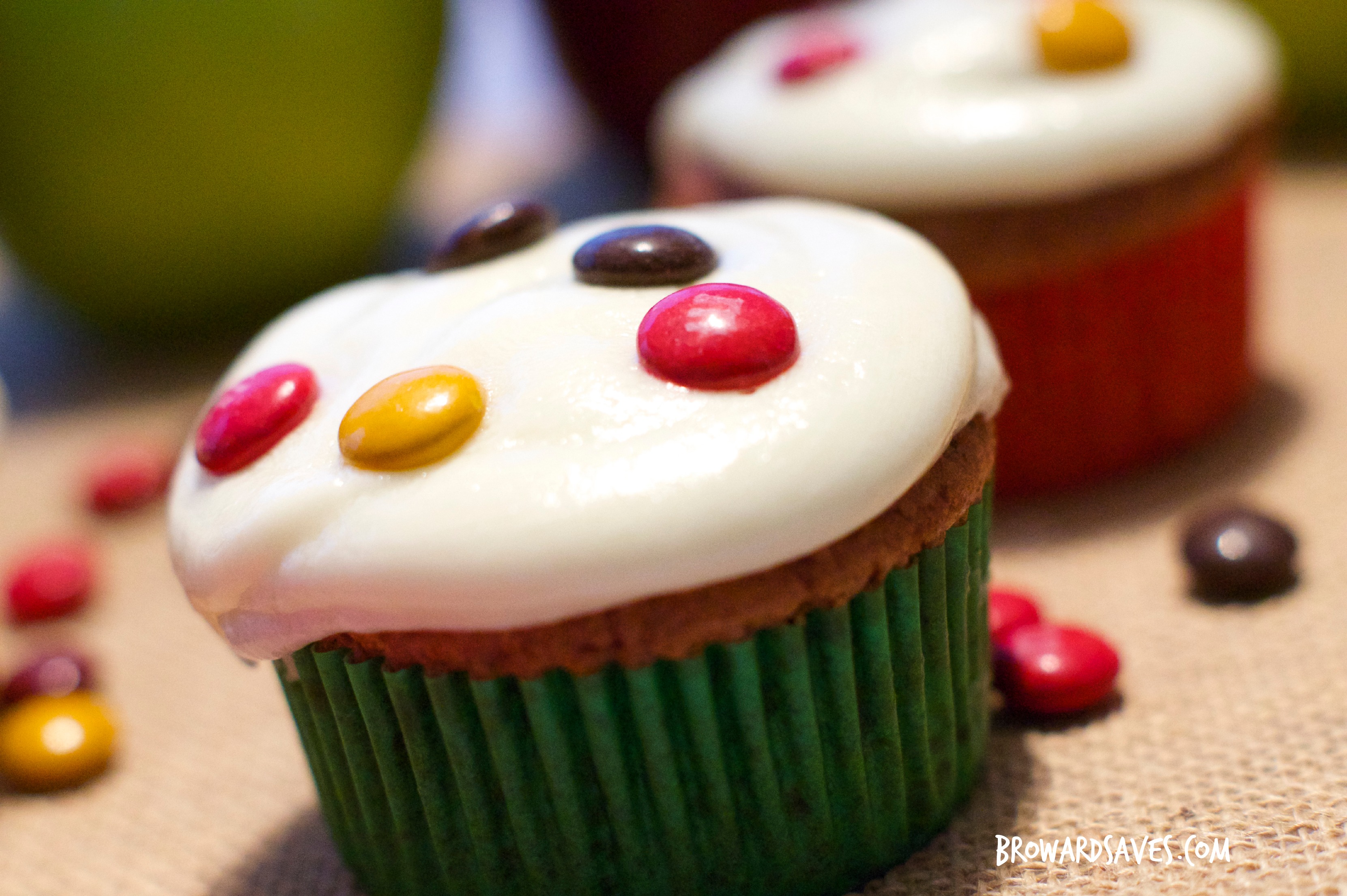 This amazing apple chocolate spiced cupcakes are topped with homemade cider frosting and delicious m&m's. The perfect kid-friendly dessert for fall!