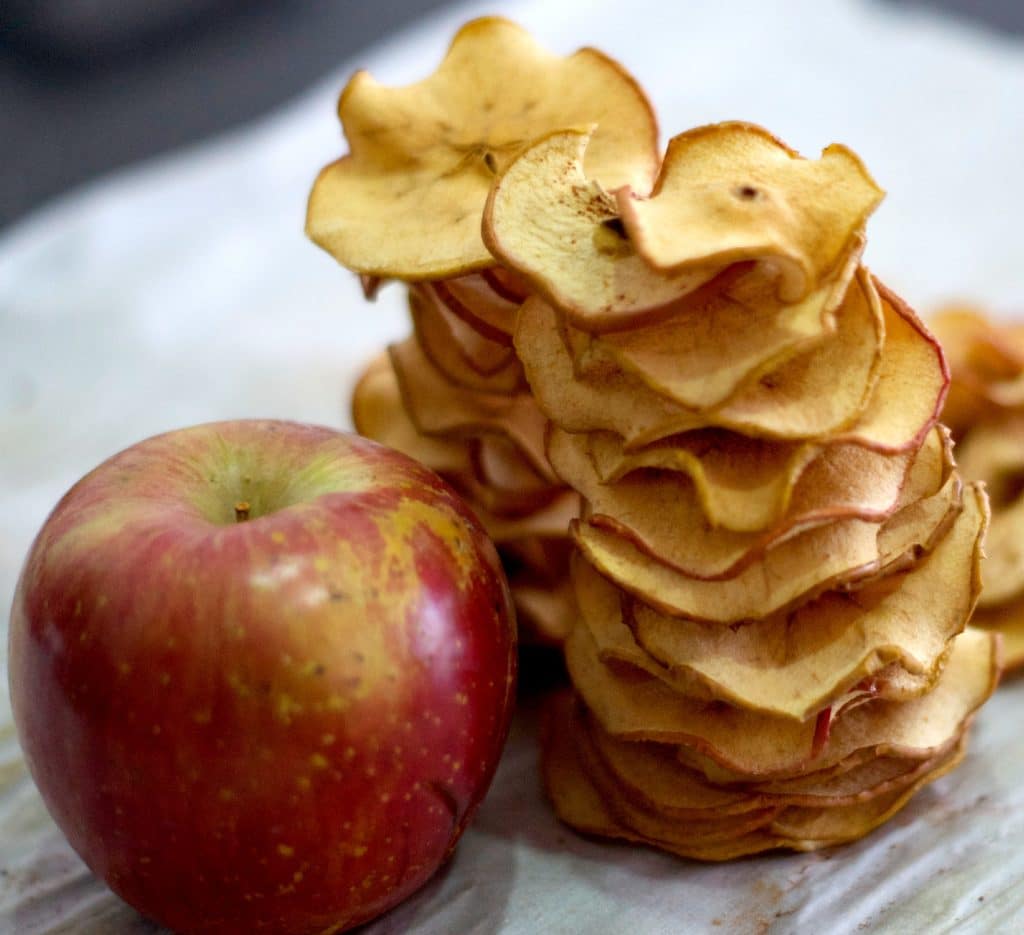 Easy to make and delicious! The oven does the hard work. Make these Apple Chips recipe at home, kid friendly and customizable. Love the crunchy spicy chips. More back to school recipes at livingsweetmoments.com