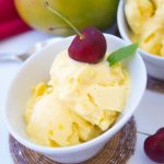 This creamy homemade mango frozen yogurt recipe only requires 3 ingredients to make and no ice cream machine needed. A perfect summer dessert for a hot day