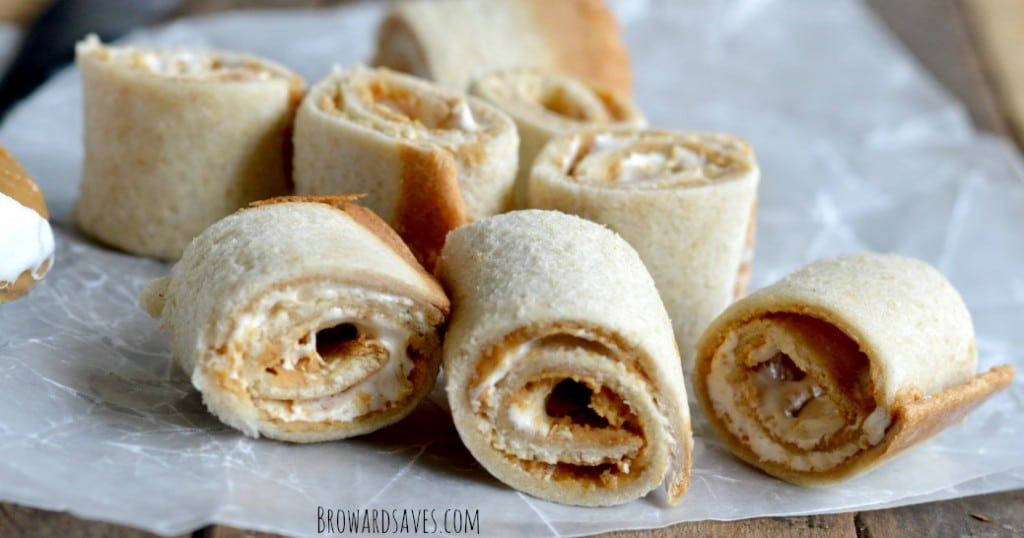 These easy peanut butter roll ups recipe requires only 3 ingredients and are the perfect fun snack to pack for the lunch box. No cooking needed! 