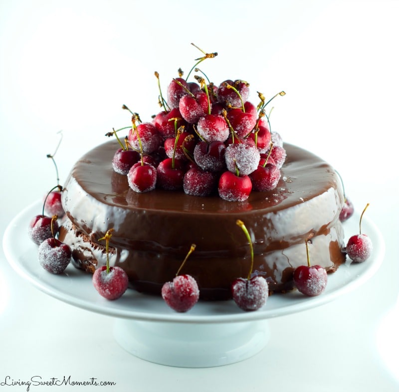 This spectacular Chocolate Cake Recipe with frosted cherries will not disappoint. The cake is chocolate with chocolate ganache and some snowed cherries. Yum