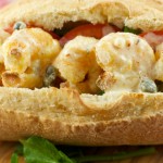 Shrimp Po'boys - served with a delicious creole Remoulade sauce. Shrimp is battered in cornmeal and oven fried to perfection. A perfect addition to your Mardi Gras celebration