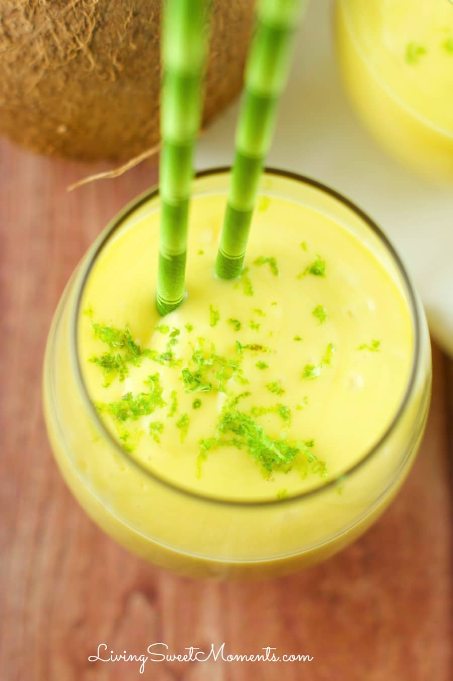 Mango Coconut Smoothie - Delicious 3 ingredient smoothie. Enjoy tropical flavors in a decadent thick smoothie that takes just seconds to make. Perfect breakfast or afternoon snack.