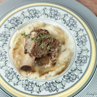 Slow Cooker Short Ribs - Made with red wine and delightful herbs. This delicious dish falls off the bone creating tender flavorful beef that requires very little prep.