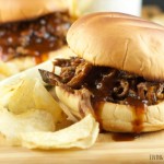 Slow Cooker Pulled BBQ Beef Sandwiches: delicious and tender beef slow cooked in a homemade BBQ sauce served on a toasted hamburger bun. Perfect for parties