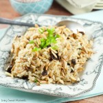 Coca Cola Rice Recipe : This delicious latin rice made with coca cola is topped with raisins and toasted almonds. Great and easy side dish to any meal. Yum!