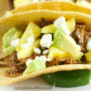 Tacos Al Pastor - These easy beef tacos al pastor are made in the slow cooker. Shredded beef topped with pineapple chunks, cheese and avocados. Delicious!