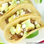 Tacos Al Pastor - These easy beef tacos al pastor are made in the slow cooker. Shredded beef topped with pineapple chunks, cheese and avocados. Delicious!