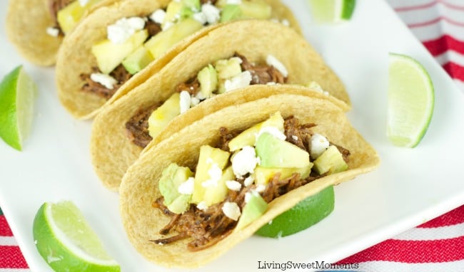 Tacos Al Pastor - These easy beef tacos al pastor are made in the slow cooker. Shredded beef topped with pineapple chunks, cheese and avocados. Delicious! 