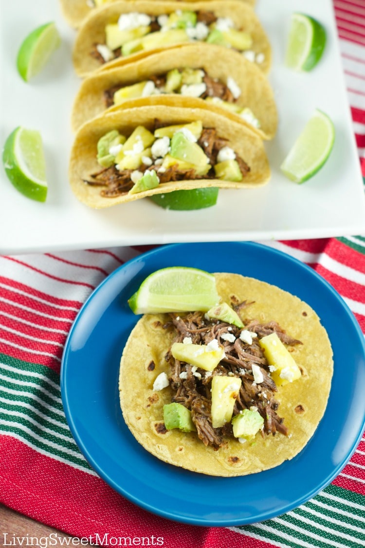 Tacos Al Pastor - These easy beef tacos al pastor are made in the slow cooker. Shredded beef topped with pineapple chunks, cheese and avocados. Delicious! 