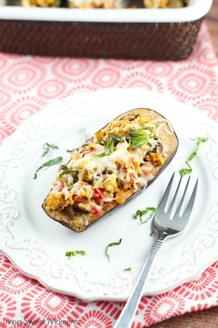 Turkey Stuffed Eggplant - Delicious lean turkey mixed with veggies and tomato sauce serve inside roasted eggplants and topped with cheese. Yummy lean recipe