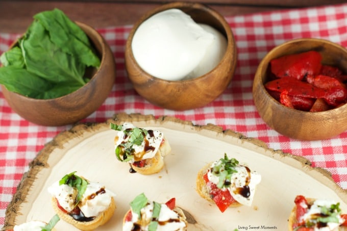 Roasted Red Pepper Burrata Crostini - crispy baguette slices are topped with roasted red peppers, creamy burrata, basil and a splash of balsamic glaze. 