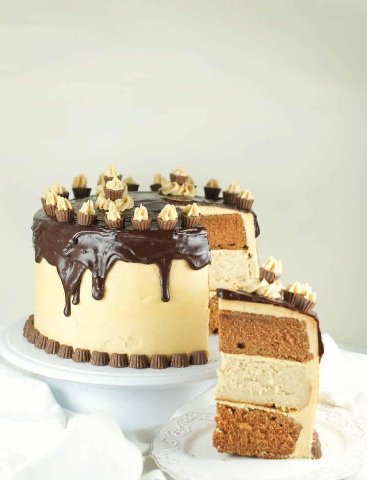 Chocolate Peanut Butter Cheesecake Cake - This is amazing cake features 2 chocolate cakes, a peanut butter cheesecake all covered in peanut butter buttercream and drizzled with chocolate ganache. The ultimate dessert. Find more at www.livingsweetmoments.com