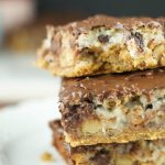 Hello Dolly Bars: these magic bars are made a graham cracker crust, chocolate chips, walnuts, cereal, coconut and more. Perfect dessert for any holiday or get together!