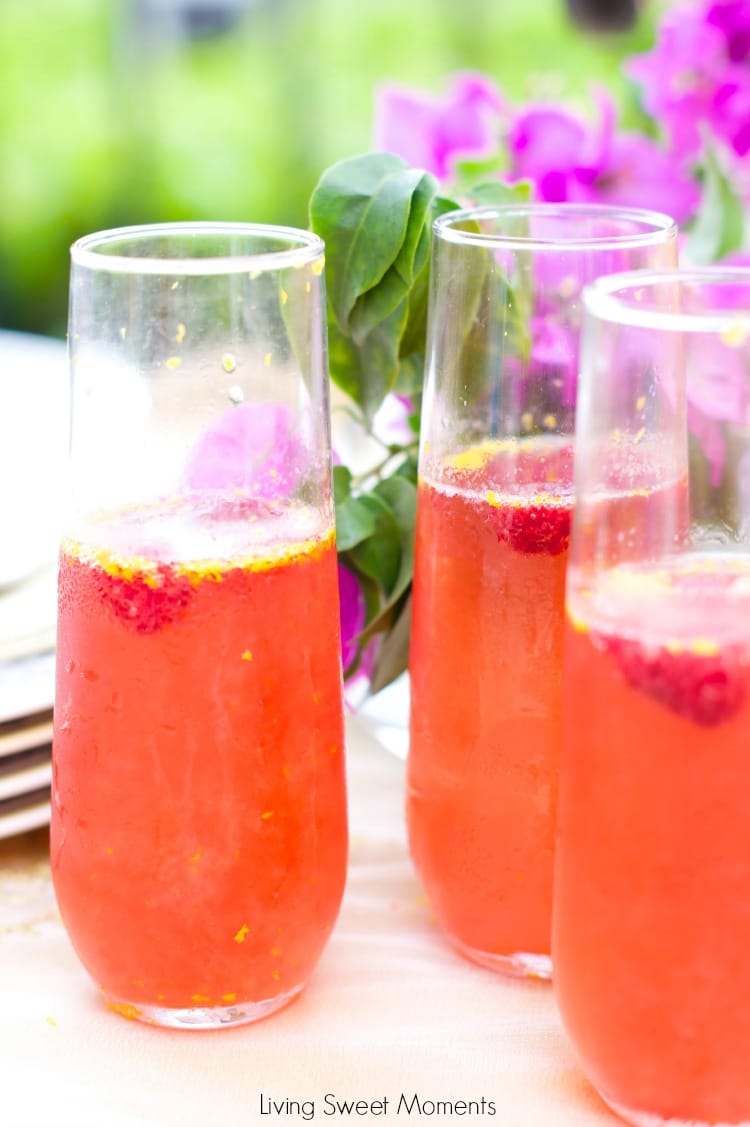 Orange raspberry sparkling wine cocktail: the ultimate summer cocktail! Combine cointreau with raspberry sorbet, fresh raspberries in a bubbly delicious drink. 