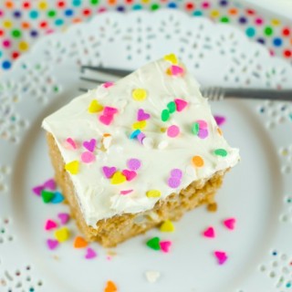 Tapioca Spiced Poke Cake - Spice cake is drenched with creamy tapioca pudding and then topped with cream cheese frosting. Perfect and easy dessert for parties and get togethers. More on www.livingsweetmoments.com