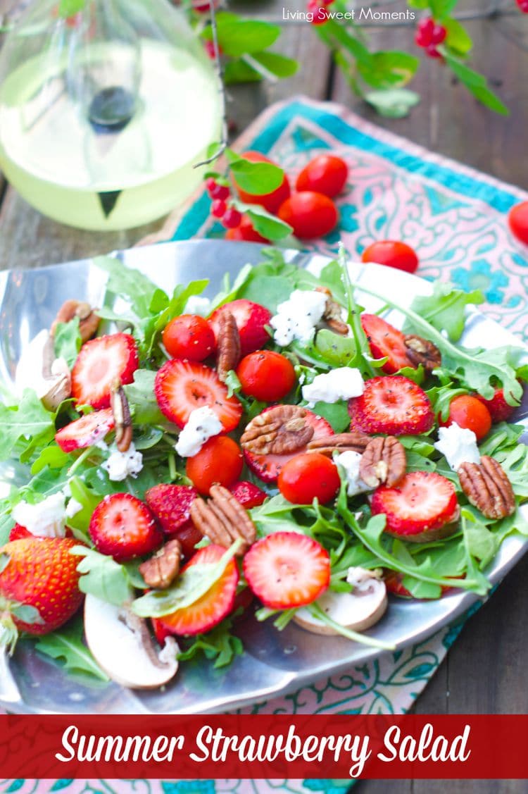 delicious Arugula salad topped with strawberries, goat cheese and toasted pecans then drizzled with a simple vinaigrette