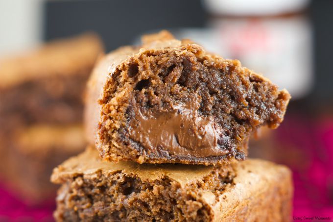 Nutella Stuffed Brownies - the best fudgey brownies recipe filled with an ooey gooey center of Nutella. The perfect chocolate dessert for any occasion. More on www.livingsweetmoments.com