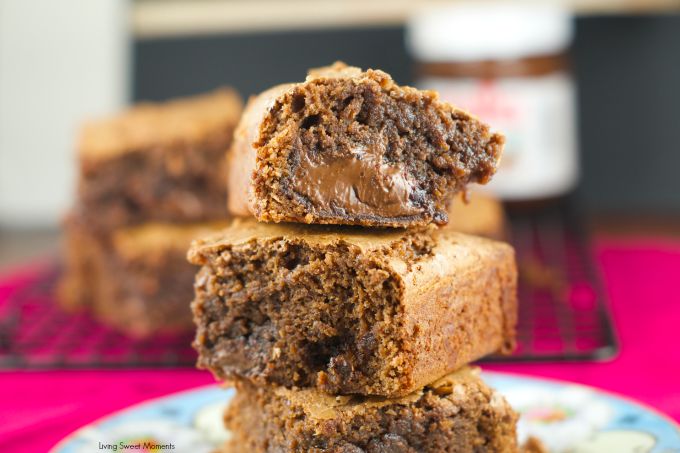 Nutella Stuffed Brownies - the best fudgey brownies recipe filled with an ooey gooey center of Nutella. The perfect chocolate dessert for any occasion. More on www.livingsweetmoments.com