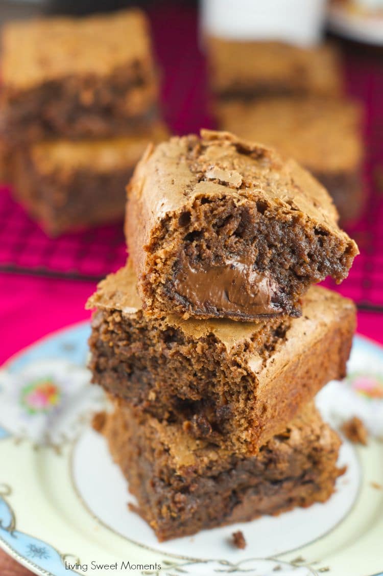 Nutella Stuffed Brownies - the best fudgey brownies recipe filled with an ooey gooey center of Nutella. The perfect chocolate dessert for any occasion. More on www.livingsweetmoments.com