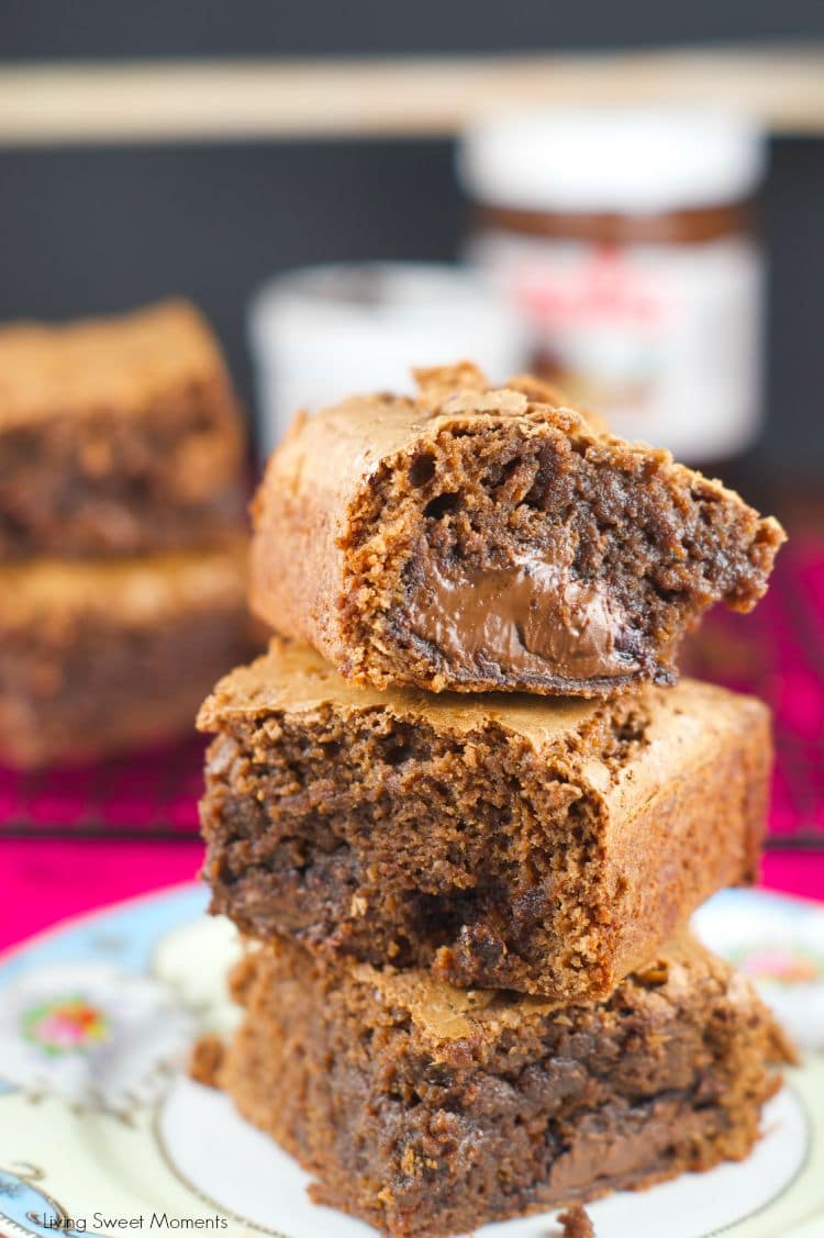 Nutella Stuffed Brownies - the best fudgey brownies recipe filled with an ooey gooey center of Nutella. The perfect chocolate dessert for any occasion. More on www.livingsweetmoments.com