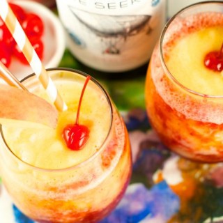 Riesling Peach And Cherry Slushies: delicious frozen cocktail with wine, cherries and peaches. Perfect to enjoy poolside or for entertaining. Refreshing!