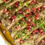 Wine And Pomegranate Brisket Recipe: delicious braised brisket with a pomegranate and wine sauce. Perfect & easy beef dinner for parties and entertaining.