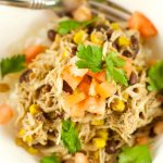 Slow Cooker Chicken And Black Beans - Delicious chicken is slow cooked in beans, corn, salsa verde and spices. Enjoy over rice or as a burrito bowl. Perfect weeknight dinner idea!