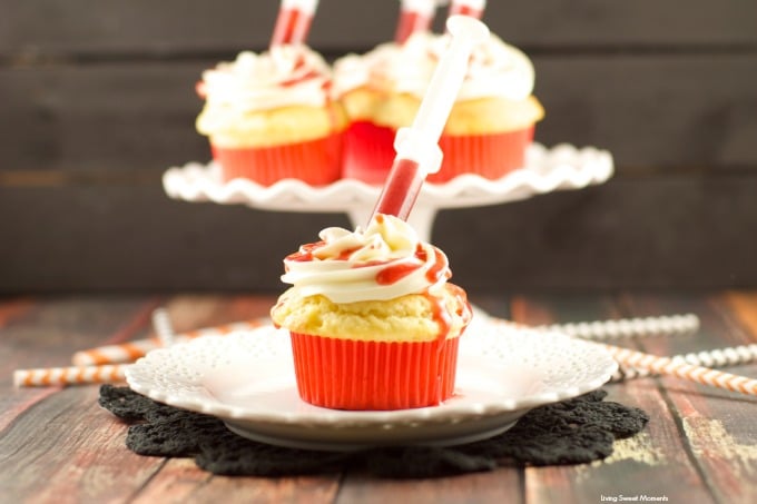 Bloody Cupcakes - the perfect Halloween Treat for a party! Vanilla cupcakes with vanilla buttercream filled with strawberry coulis. Decadent and original!