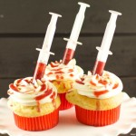 Bloody Cupcakes - the perfect Halloween Treat for a party! Vanilla cupcakes with vanilla buttercream filled with strawberry coulis. Decadent and original!